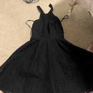 black 2 layered dress with lace detailing.